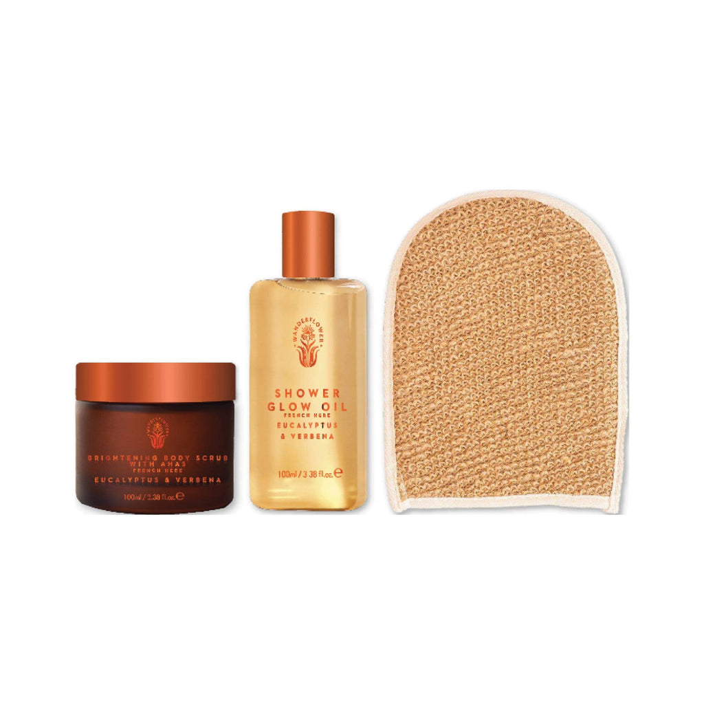 Three skincare products including a jar, bottle, and scrub pad on a white background