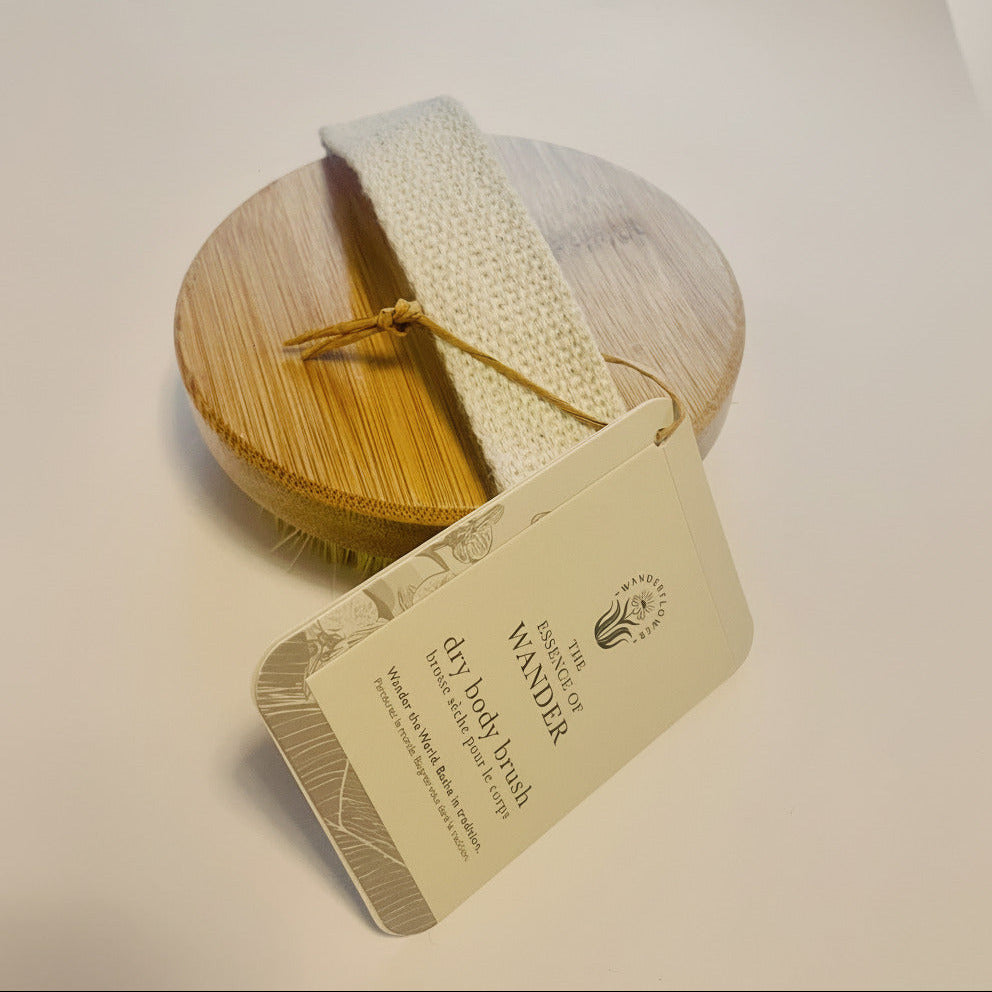 Barely used wooden brush with bristles on a white background