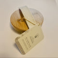 Barely used wooden brush with bristles on a white background
